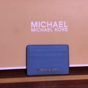 Beautiful blue Michael Kors card holder. Never used.